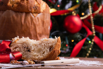 traditional christmas panettone on wooden table with decorations