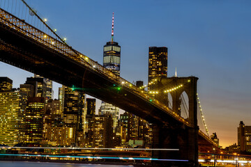 Fototapeta na wymiar Brooklyn Bridge and Manhattan over East River at sunset, New York US