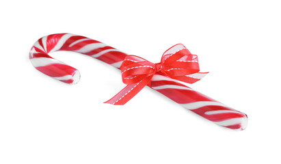 Sweet Christmas candy cane with red bow isolated on white