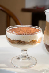 Tiramisu italian dessert on a cafe table