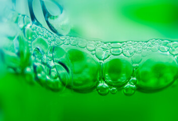 Green air bubbles in water close up