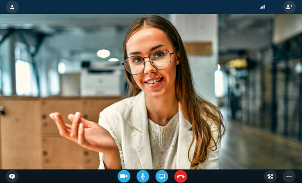 Headshot portrait application screen view of female worker at online interview using web conference on computer, young businesswoman talking by video call on laptop with partner from home
