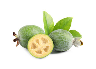 Cut and whole feijoas with leaves on white background