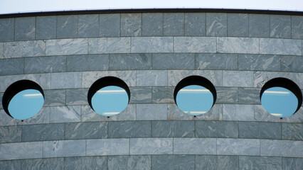 Facade of a modern building with round windows