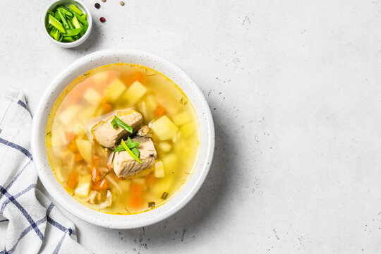 Traditional fish soup, ukha in a bowl. Space for text, top view.
