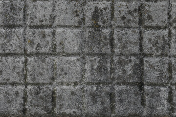 dark gray stone wall with squares,  texture for a background, no person