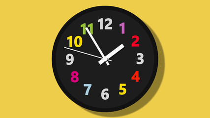 black wall clock with colorful numbers on yellow background