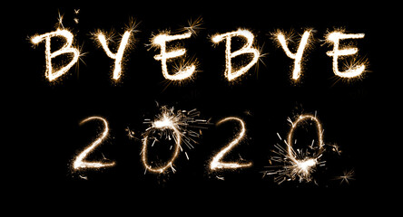 Bye Bye 2020. Bright text made of sparkler on black background, banner design