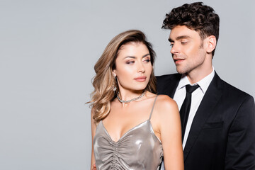 elegant young couple posing isolated on grey, stock image