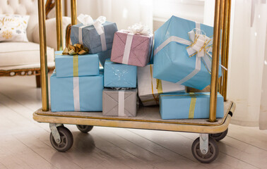
packed boxes with Christmas gifts on a trolley, many New Year's gifts