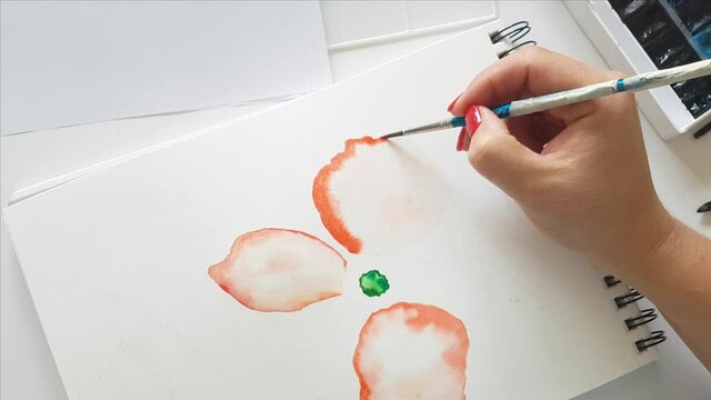 Painting flower with watercolors close up