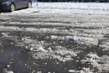 Uncleaned from snow, icy street. Slippery road in winter.