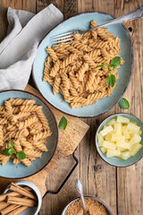 Fusilli pasta with sweet roasted semolina and cinnamon, served with pineapple pieces