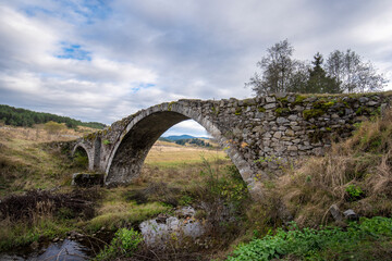 Fototapeta na wymiar Old Roman bridge in the Rhodope mountain near Zmeitsa village, Bulgaria. 