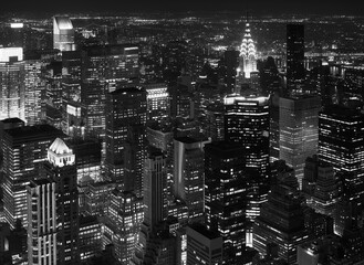 Black and white aerial photo of Manhattan at night, New York City, US.