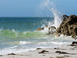 Waves crashing on rocks on the Gulf of Mexico at St. Pete Beach, Florida.