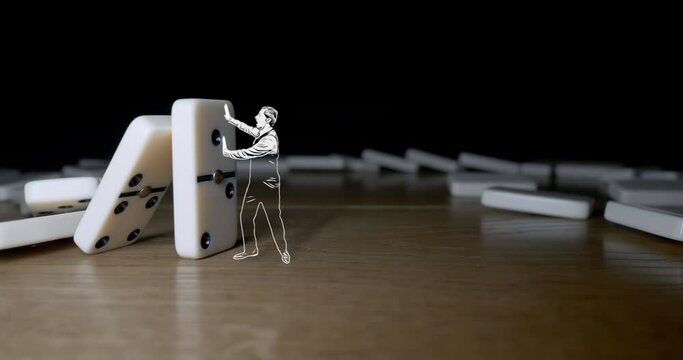 A drawn businessman stops white dominoes falling on wooden background.