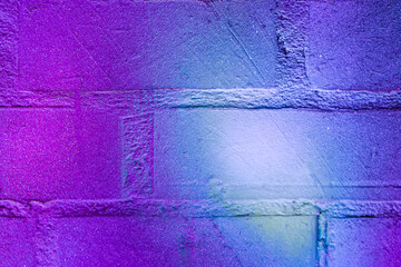 Art under ground. Beautiful street art graffiti background. The brick wall is decorated with abstract drawings house paint. Modern style urban culture of street youth. Abstract picture on wall