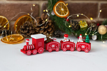 Red train on the backdrop of christmas decorations