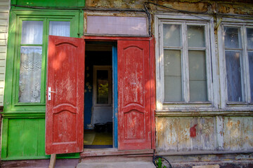 Fototapeta na wymiar Old house with open door
