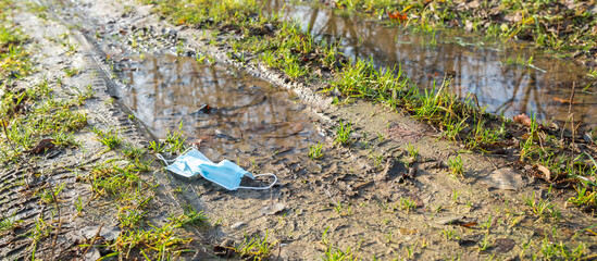 Waste Coronavirus, Covid 19 Pandemic Garbage Face Masks in Nature, Environmental Pollution, Land Waste COVID-19 Waste