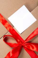Wrapped vintage gift box with red ribbon bow