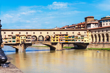 Medieval Ponte Vecchio bridge across Arno river in Florence, Tuscany, Italy.