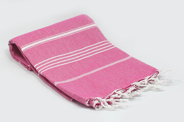 Peshtemal Turkish bath cotton towel folded textile. Beautiful bright colors with natural light background. Perfect online market digital shop sales.