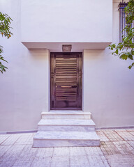 Contemporary house entrance black painted metal door, Athens Greece