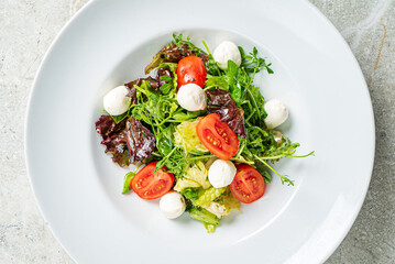 fresh salad with mozzarella and vegetables