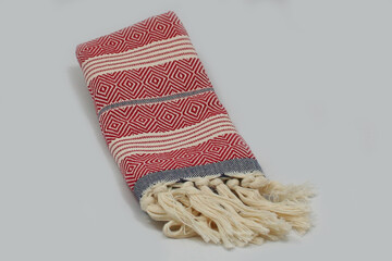 Peshtemal Turkish bath cotton towel folded textile. Beautiful bright colors with natural light background. Perfect online market digital shop sales.