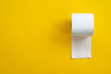 One toilet paper roll isolated on yellow background