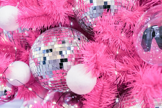 Mirrored disco balls on a pink Christmas tree.