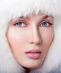 Beauty Fashion Model Girl in a Fur Hat