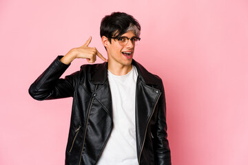 Young skinny hispanic man person pointing by hand to a shirt copy space, proud and confident