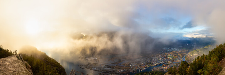 Panoramic Aerial View of Squamish City during a sunny sunset. Taken from Chief Mountain, near Vancouver, British Columbia, Canada.
