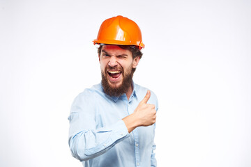 Engineers shirt orange hard hat construction lifestyle emotions cropped view light background
