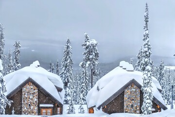 Cozy vacation cabins covered with fresh snow. Big White Ski resort. Kelowna. British Columbia....