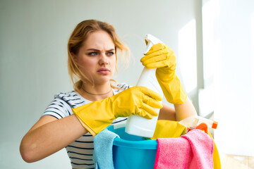 Woman holding in hand detergent cleaning house care lifestyle 