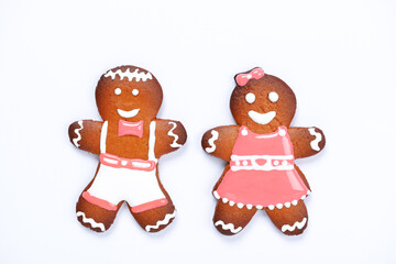 The hand-made eatable gingerbread little men on white background