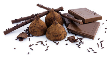 Chocolate delicious dessert in the form of sweets, chocolate pieces, crispy sticks on an isolated white background.