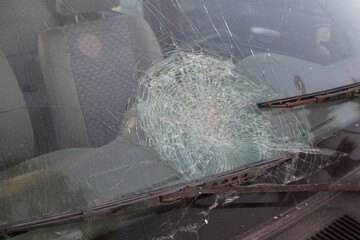 cracked the front window of the car
