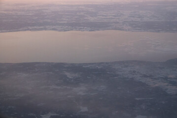 Plane view of foggy morning lake 