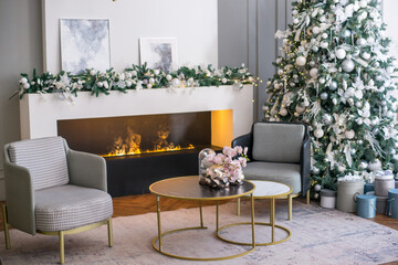 Living room with fireplace and chrismas tree