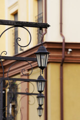 A row of street lamps in an urban environment.