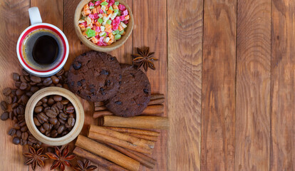 image of coffee beans and cups with coffee on wooden table top view