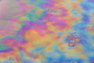 Obraz na płótnie Canvas Oil petrol water pollution. Ecological disaster. Slick industry oil fuel spilling water pollution. Water surface patches of gasoline and oil. Ecological catastrophy. Concept of environmental problems