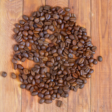 image of coffee beans on a wooden table top view