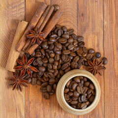 image of coffee beans and cups with coffee on wooden table top view