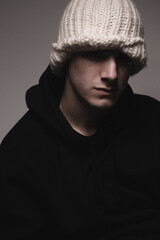 Handsome male model in black sweatshirt